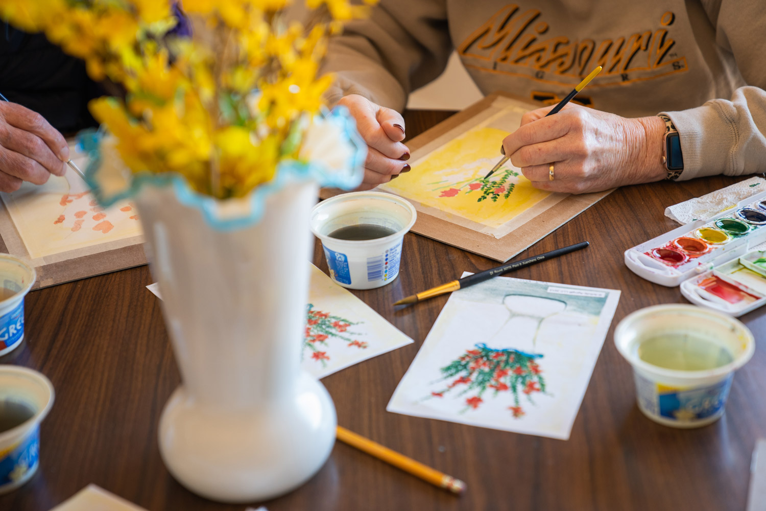 Senior residents enjoying an art therapy experience at Mari de Villa.