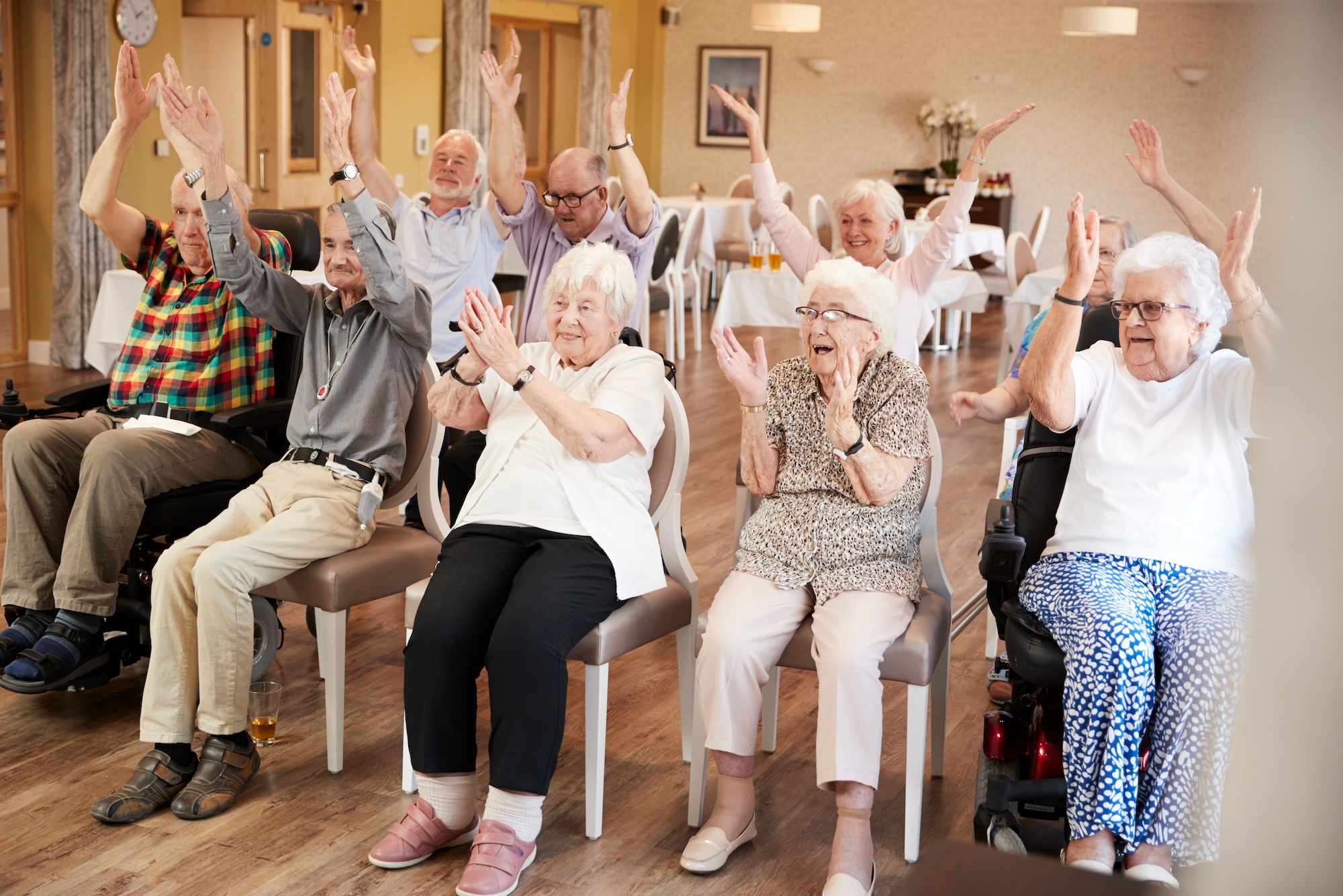 Seniors participating in a fun group activity at Mari de Villa, reflecting the engaging lifestyle offered by 55+ communities near me in St. Louis.